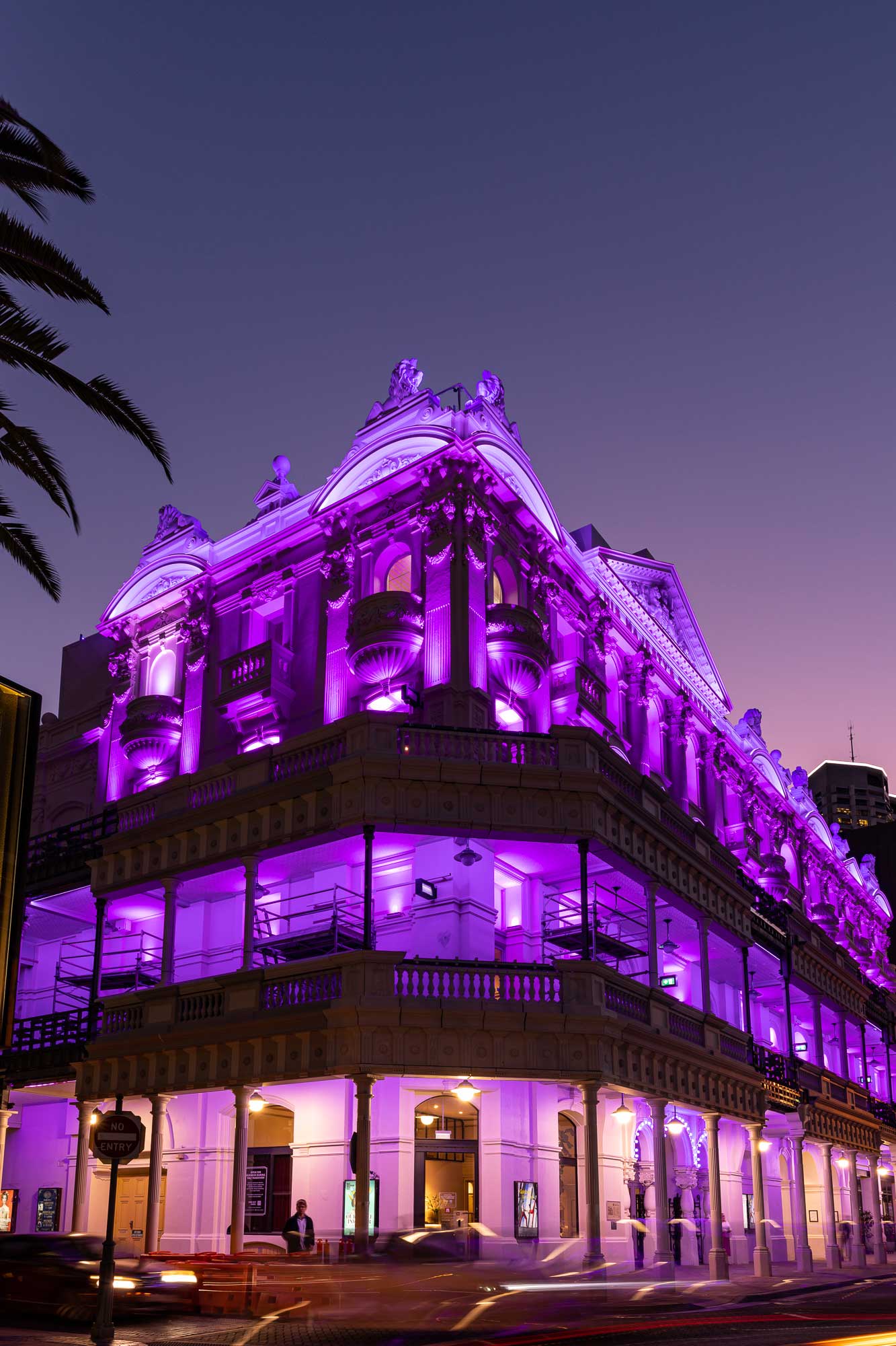 His Majesty's Theatre lit in purple lighting at night