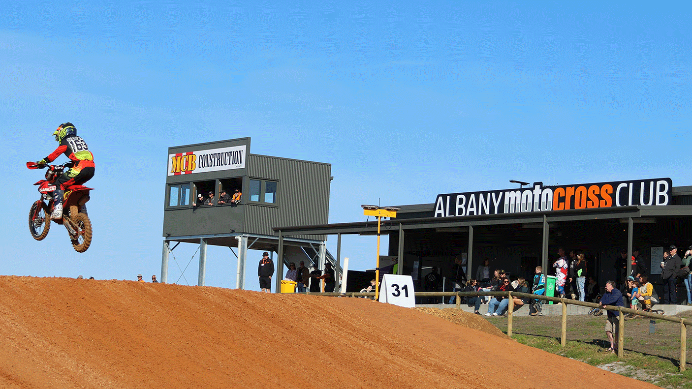 A motor bike rider on a jump at the Albany Moto Cross Club