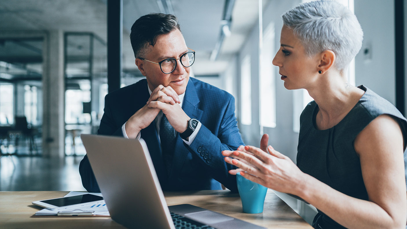 Man and woman in discussion in the workplace