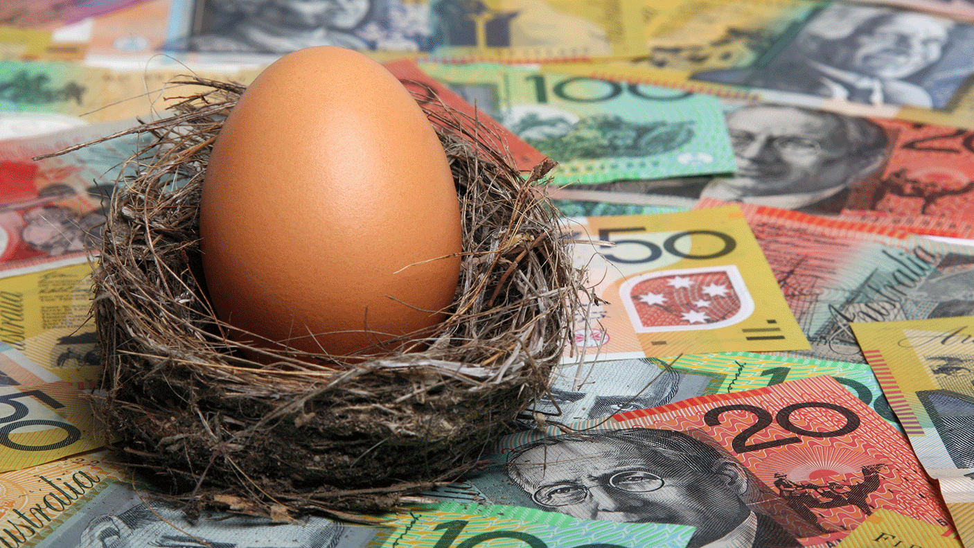 An egg in a nest, on top of a number of Australian bank notes.