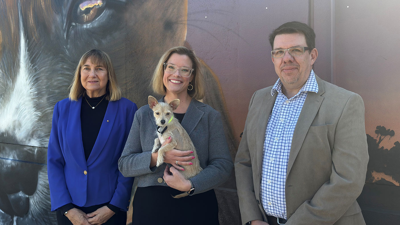 RSPCA WA Chair Lynne Bradshaw, Local Government Minister Hannah Beazley holding a small dog, and RSPCA WA CEO Ben Cave