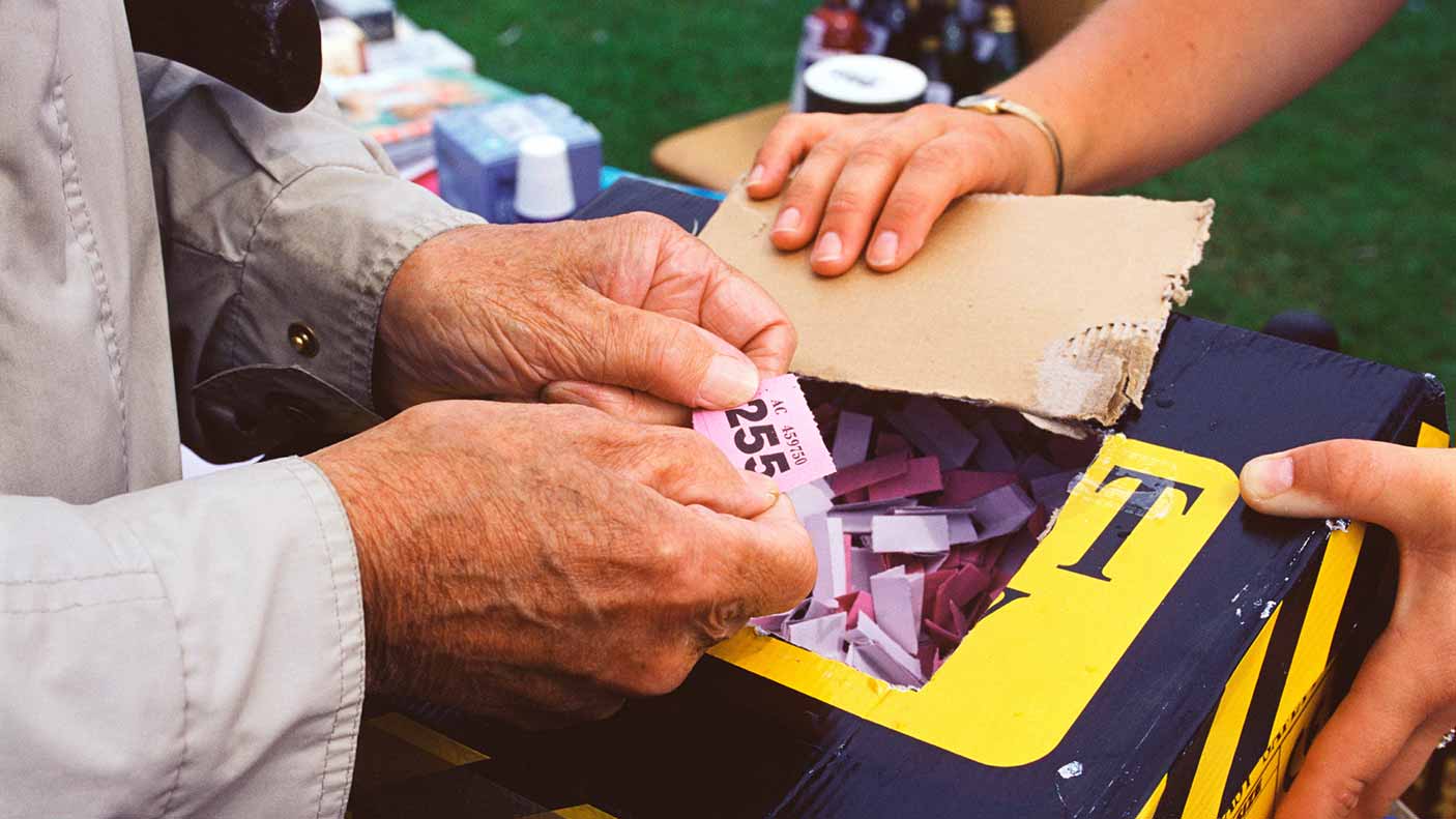 Holding a raffle ticket