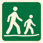 Symbol for Australian Walking Track Grade 2: two figures hiking on a mostly flat track