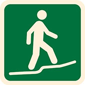 Symbol for Australian Walking Track Grade 3: figure walking on a path with a slight incline