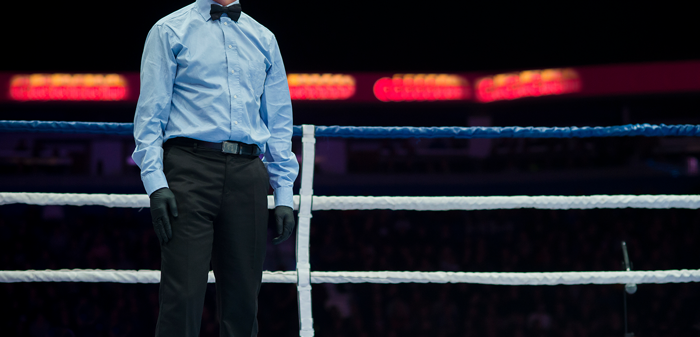 Midsection Of Referee Standing In Boxing Ring - stock photo