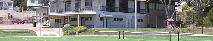 Example of tennis and hockey utilising the same sand filled synthetic turf surface