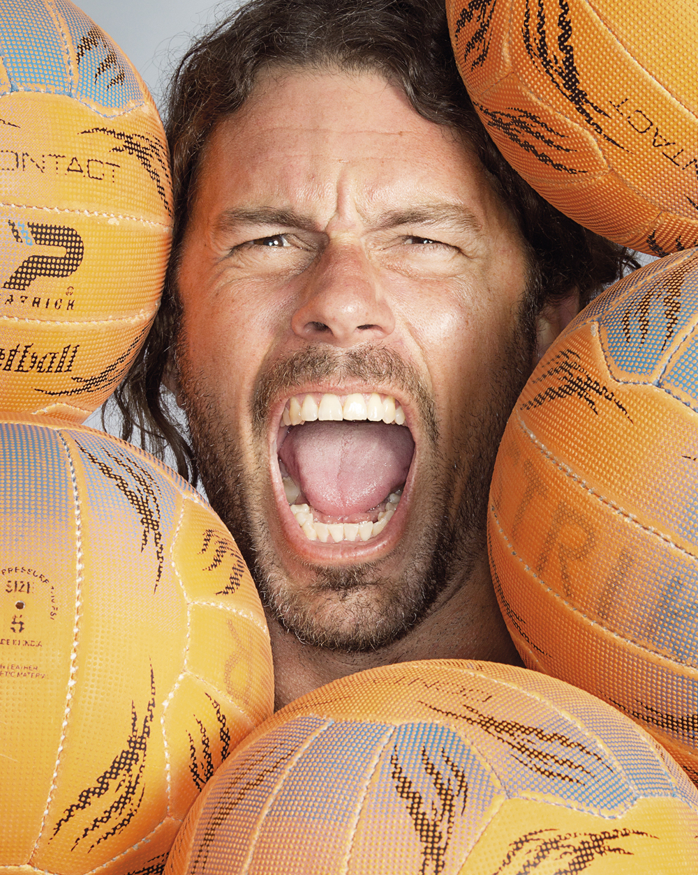 Portrait of Adam Laycock amongst netballs