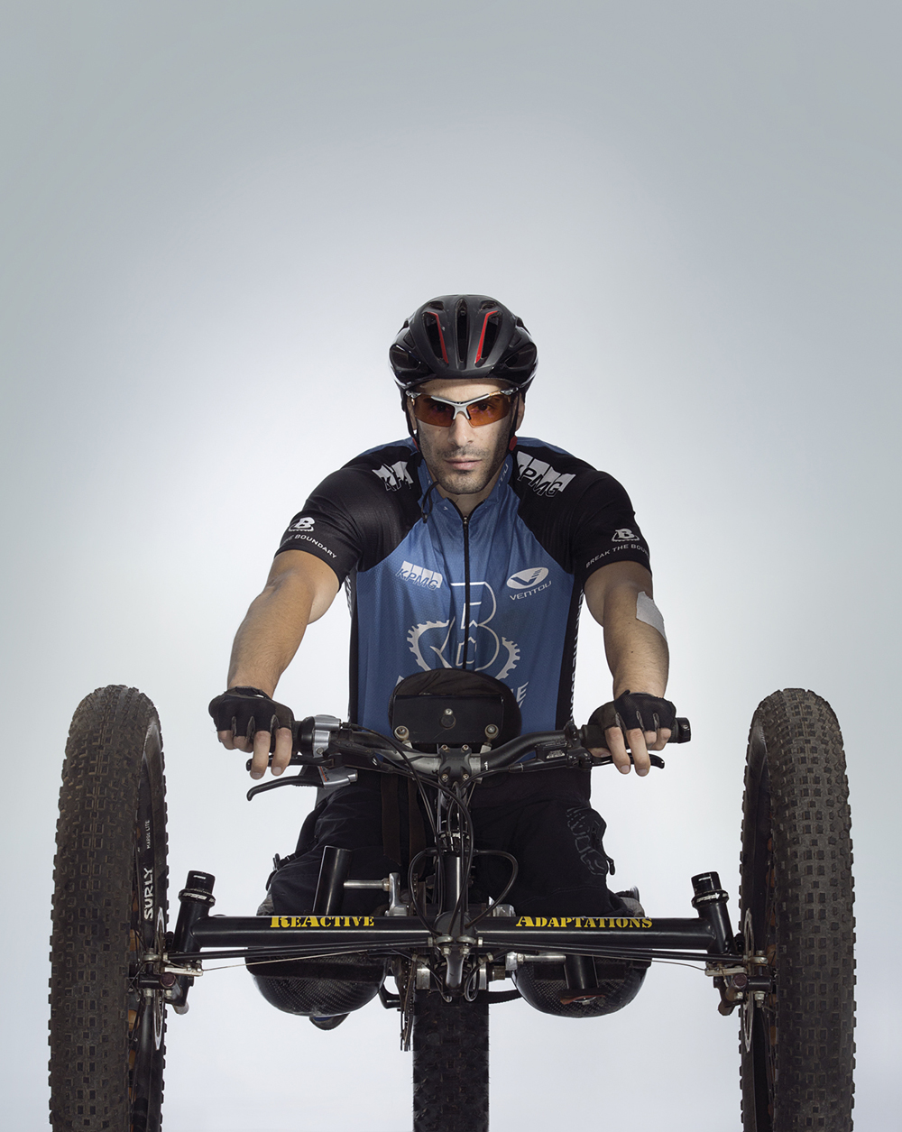 Portrait of Andrew Liddawi on a hand cycle