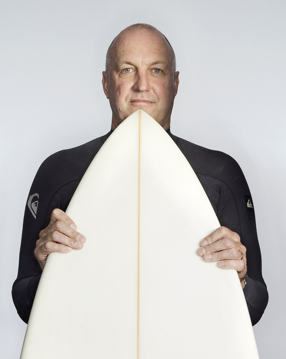 Portrait of Mark Lane with a surfboard