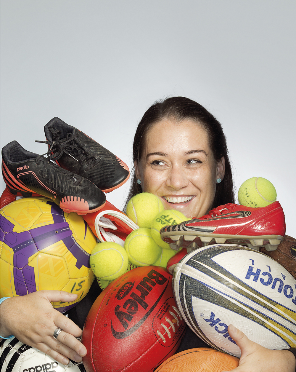Portrait of Nicki Bardwell holding sports equipment