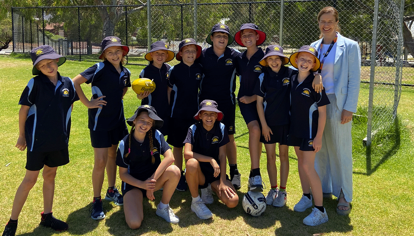 Students at Springfield Primary School Kallaroo, with Sue-Ellen Morphett, DLGSC stand on the school oval