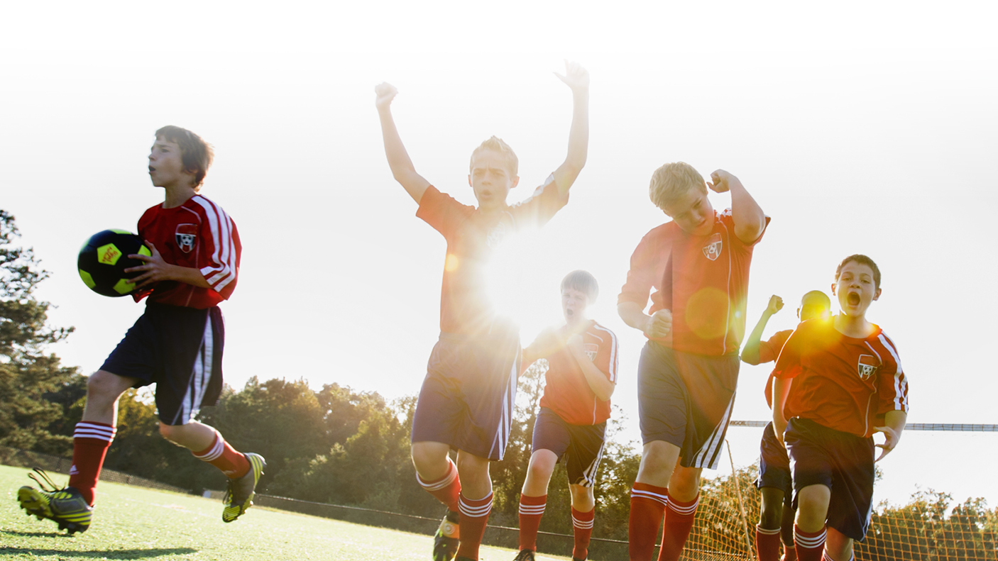 Young people playing soccer